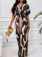 Abstract Print Wide-Leg Jumpsuit with ruched beige and black abstract patterns, a V-neck, and short sleeves made from polyester