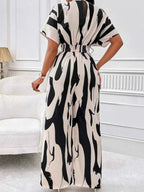 Abstract Print Wide-Leg Jumpsuit in black and white with ruched waist and loose short sleeves made from polyester fabric
