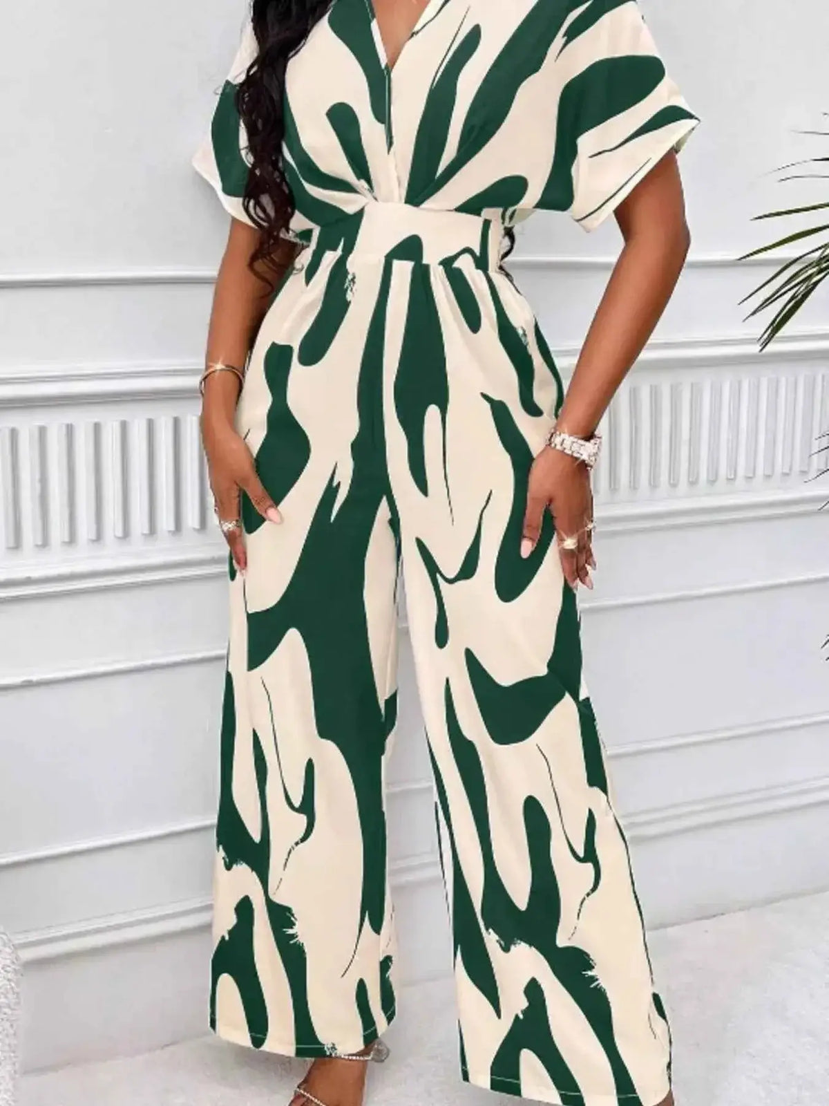 Abstract Print Wide-Leg Jumpsuit in cream with dark green abstract patterns, featuring short sleeves and ruched waist