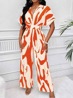 Abstract Print Wide-Leg Jumpsuit in cream and orange polyester featuring a ruched waist and wide legs