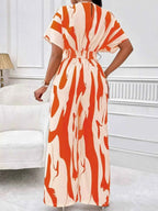 Abstract Print Wide-Leg Jumpsuit in cream and orange polyester featuring ruched waist and abstract pattern