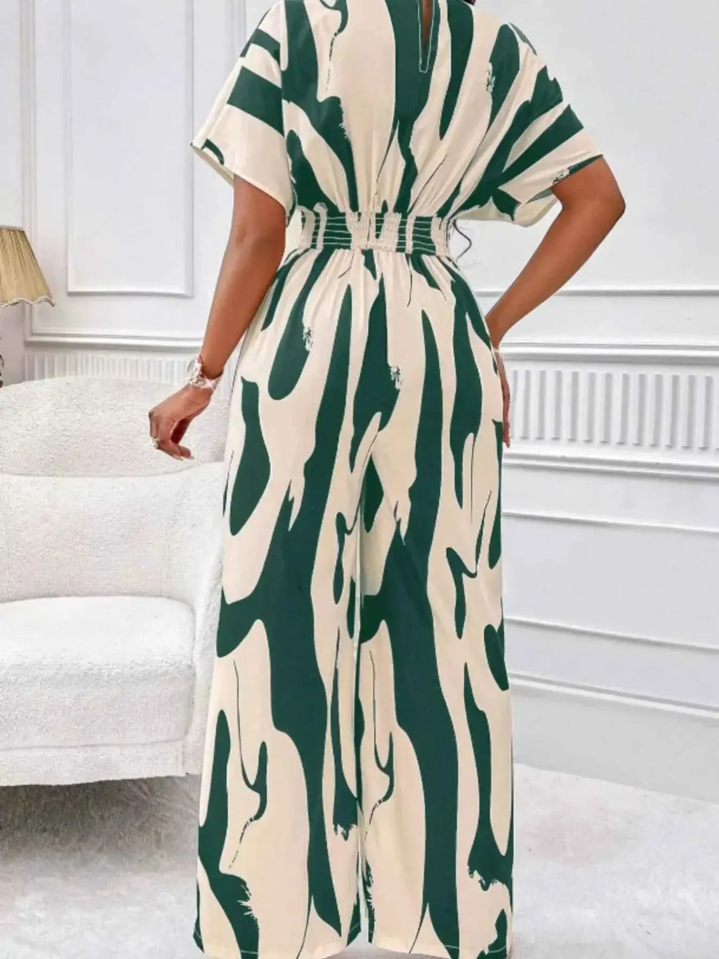Abstract Print Wide-Leg Jumpsuit with green and cream polyester fabric featuring ruched waist and an abstract pattern