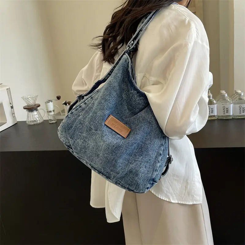 Elevate your style with the adjustable strap denim shoulder bag $29.99 bag medium denim imported product length 13 in,