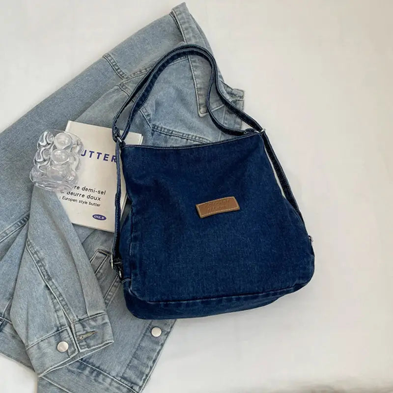 Elevate your style with the adjustable strap denim shoulder bag $29.99 bag medium denim imported product length 13 in,