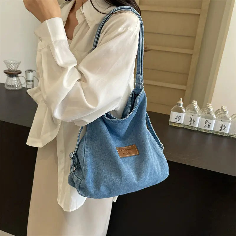 Elevate your style with the adjustable strap denim shoulder bag $29.99 bag medium denim imported product length 13 in,