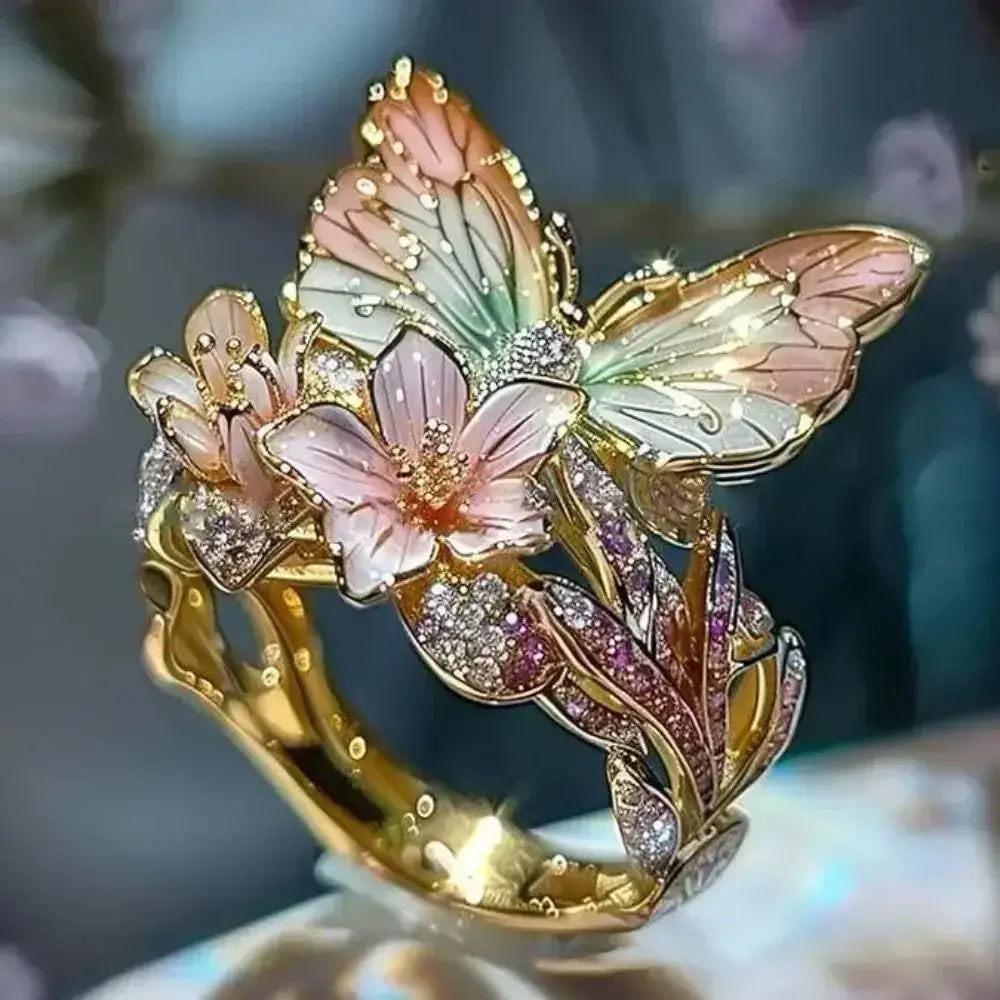 Gold-tone metal Aesthetic Flower Butterfly Rings featuring pastel gradient enamel butterfly and pink flower with rhinestone accents