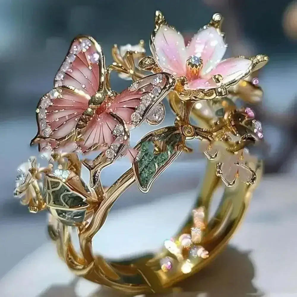 Gold metal Aesthetic Flower Butterfly Rings featuring pink enamel butterfly, pastel flower, rhinestones, and intricate design