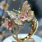 Aesthetic Flower Butterfly Rings featuring gold-tone metal with pink flower and butterfly designs accented by rhinestones