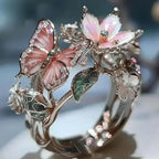 Aesthetic Flower Butterfly Rings featuring pink enamel butterfly, delicate white and green flower accents on metal alloy band