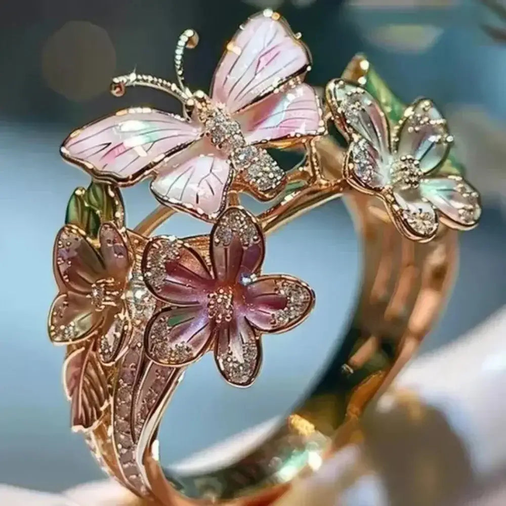 Aesthetic Flower Butterfly Rings featuring pink enamel butterflies and flowers with rhinestone accents on a gold-tone adjustable band