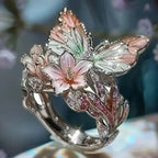 Aesthetic Flower Butterfly Rings featuring silver metal with enamel pink and green floral and butterfly designs, adorned with rhinestones