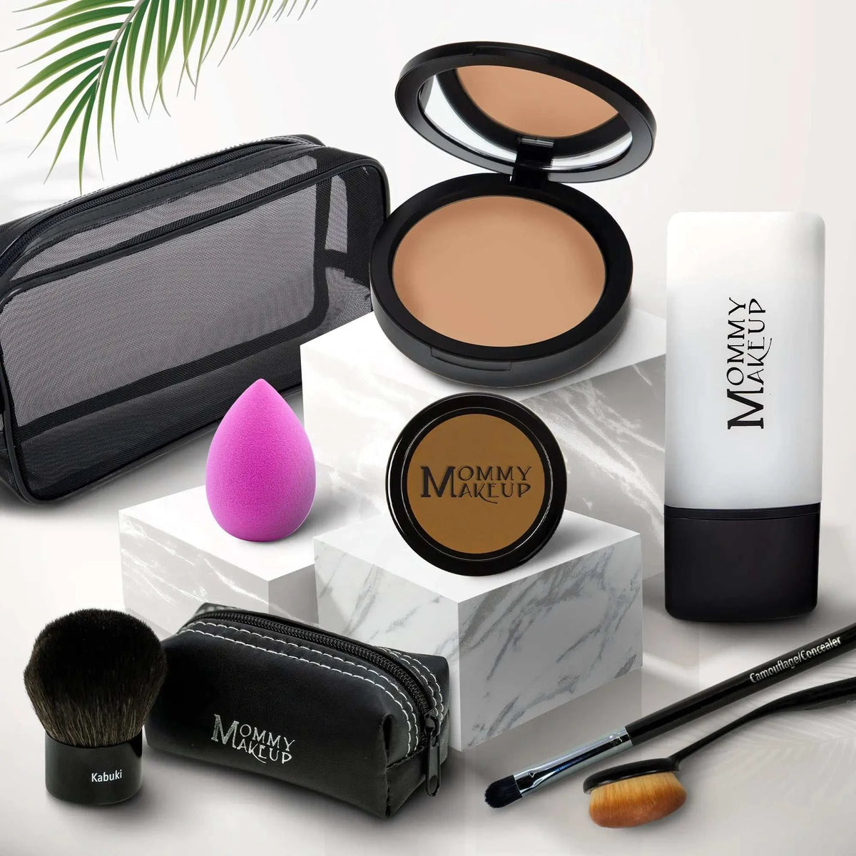 Black mesh makeup bag with white stitching and mommy makeup branding for talc-free foundation 8-piece set