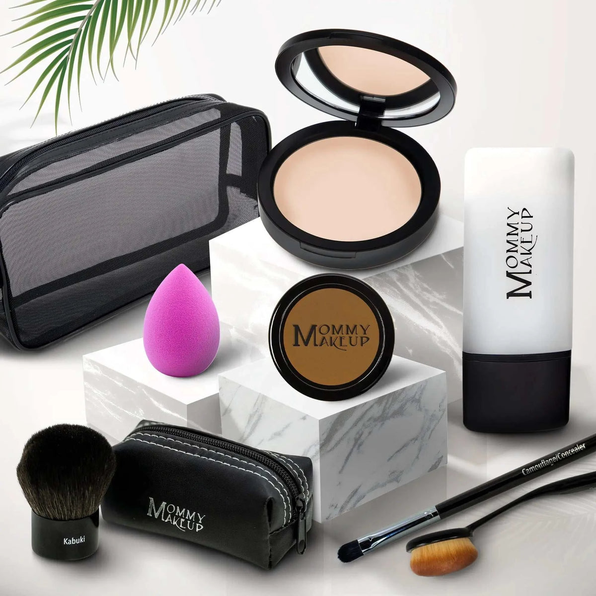 Black mesh makeup bag with white stitching and mommy makeup branding for talc-free foundation 8-piece set
