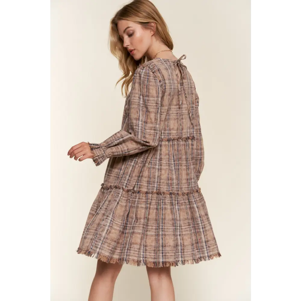 Embrace timeless designer clothing with the and the why frayed tiered dress $65.99 the washed frayed tiered plaid dress