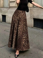 Animal Print Maxi Skirt in brown and black leopard pattern with pleated detailing, worn with black top and heels