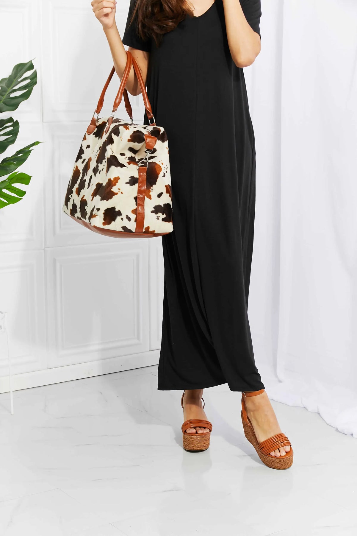Animal Print Plush medium hand bag with leopard pattern in brown and cream fluff material and top handle straps