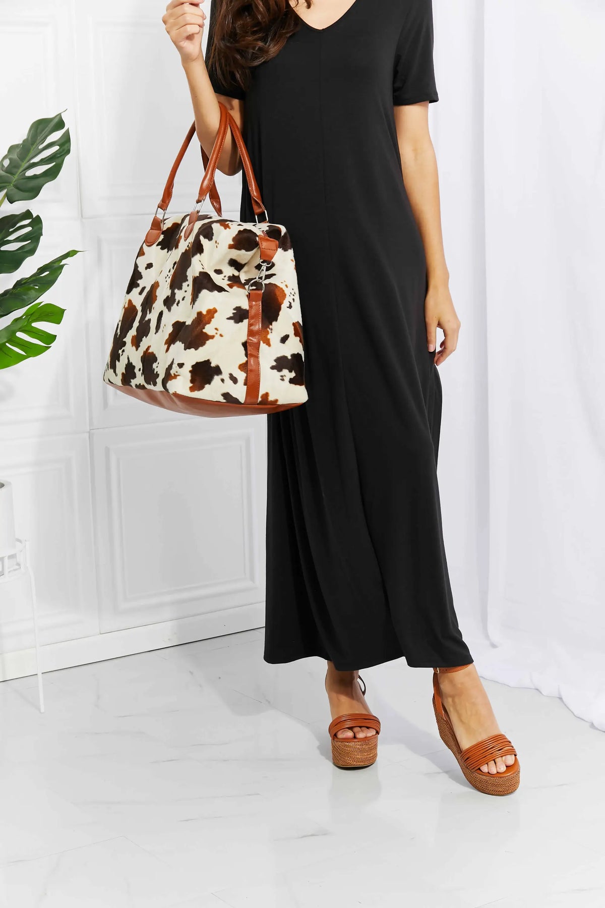 Animal Print Plush medium hand bag with brown and white leopard pattern, top handle straps, and plush material