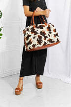 Animal Print Plush medium weekender bag with brown and white leopard pattern, fluff material, and top handle straps
