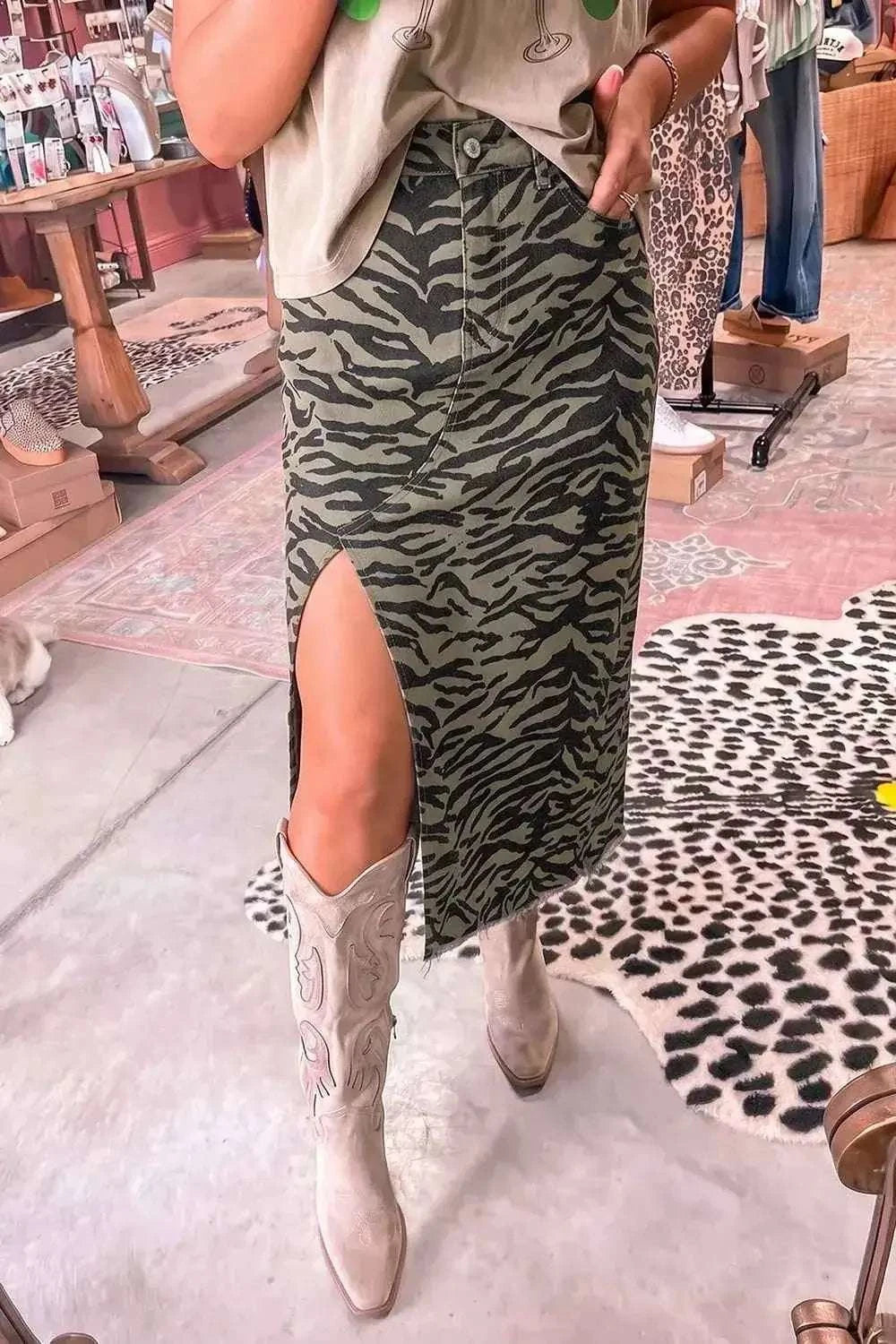 Animal Print Side Split green and black patterned midi skirt with a side slit and buttoned front worn with beige boots