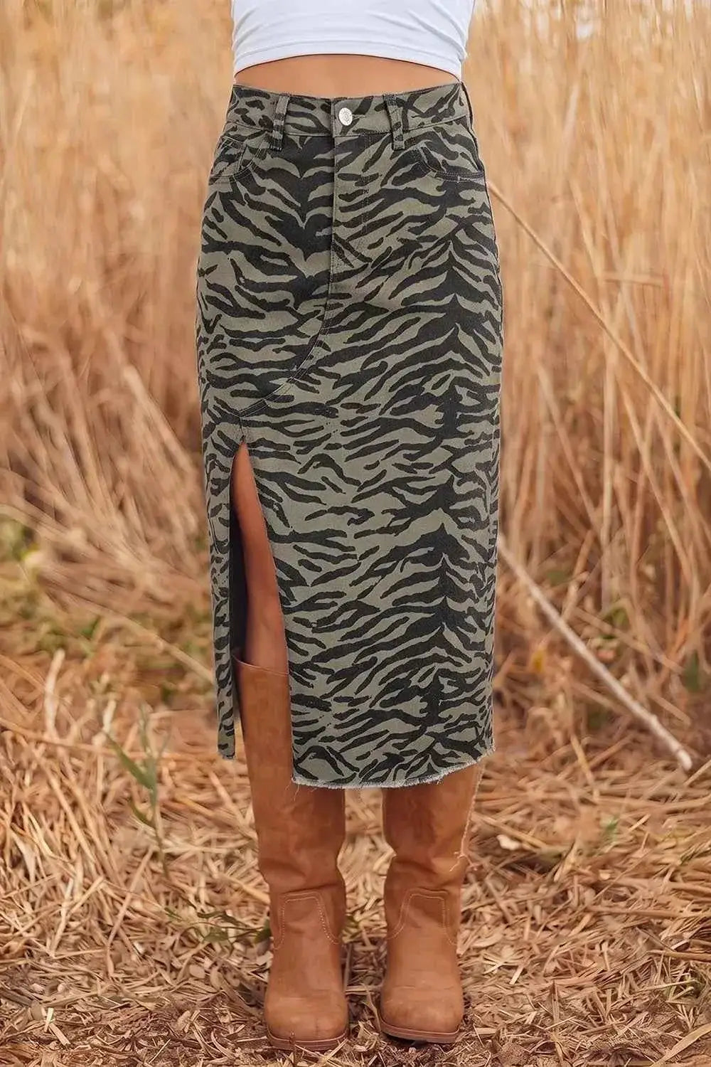 Animal Print Side Split midi skirt in green and black tiger pattern with buttoned front and frayed hem worn with brown boots