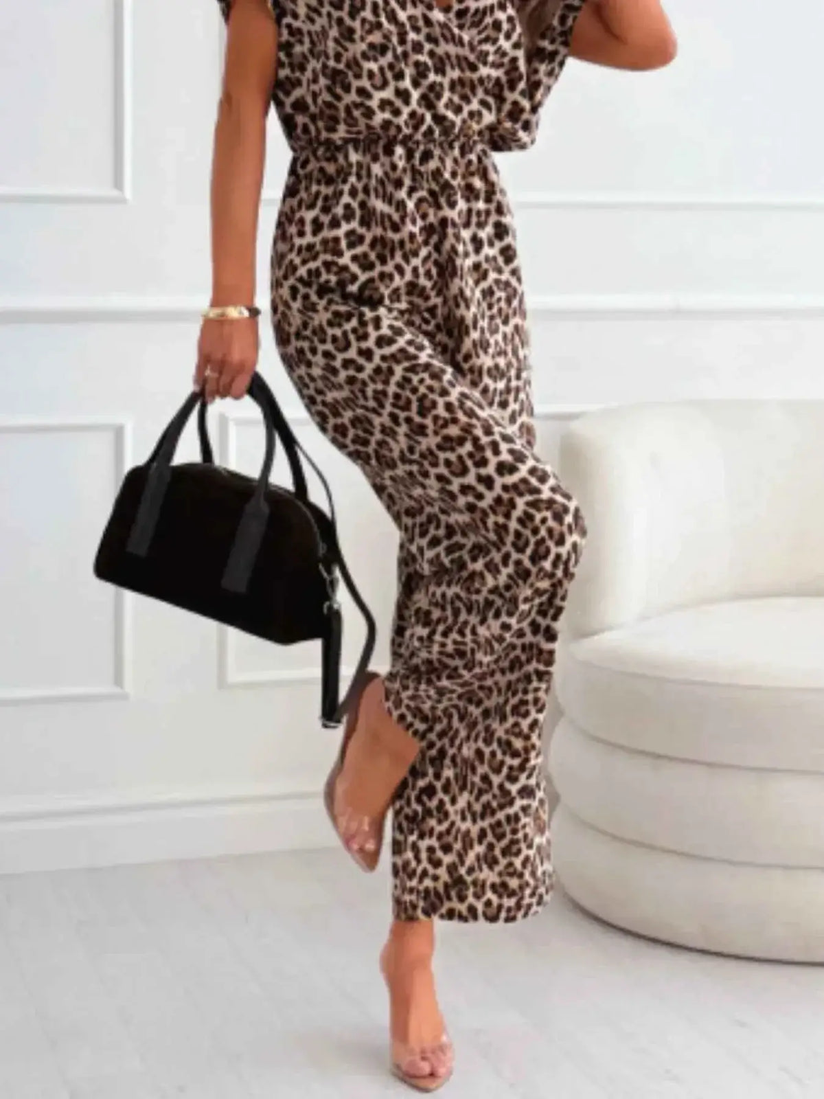 Animal Print Wide Leg Jumpsuit in brown and black leopard pattern with pockets and loose fit silhouette