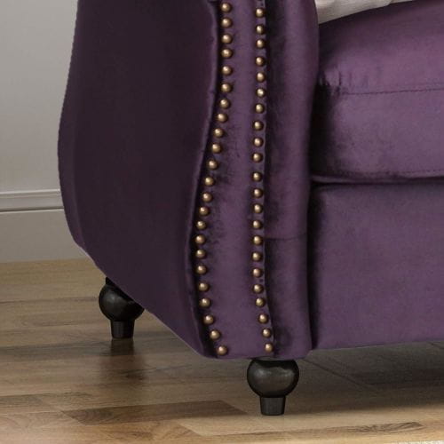 Luxurious purple velvet sofa for timeless designer clothing aesthetics