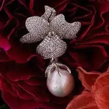 Baroque Pearl Flower Drop Earrings featuring a sparkling cubic zirconia floral top with a natural baroque pearl drop in sterling silver