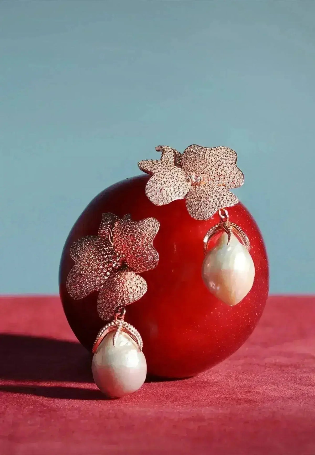 Baroque Pearl Flower Drop Earrings featuring rose gold floral design with textured petals and large unique baroque pearls