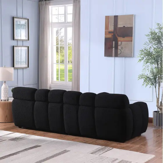 Elegant black boucle sofa for timeless designer living spaces