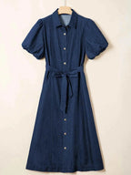 Belted Button-Down midi denim dress in dark blue 100% cotton with puff sleeves, front buttons, and tied waist belt