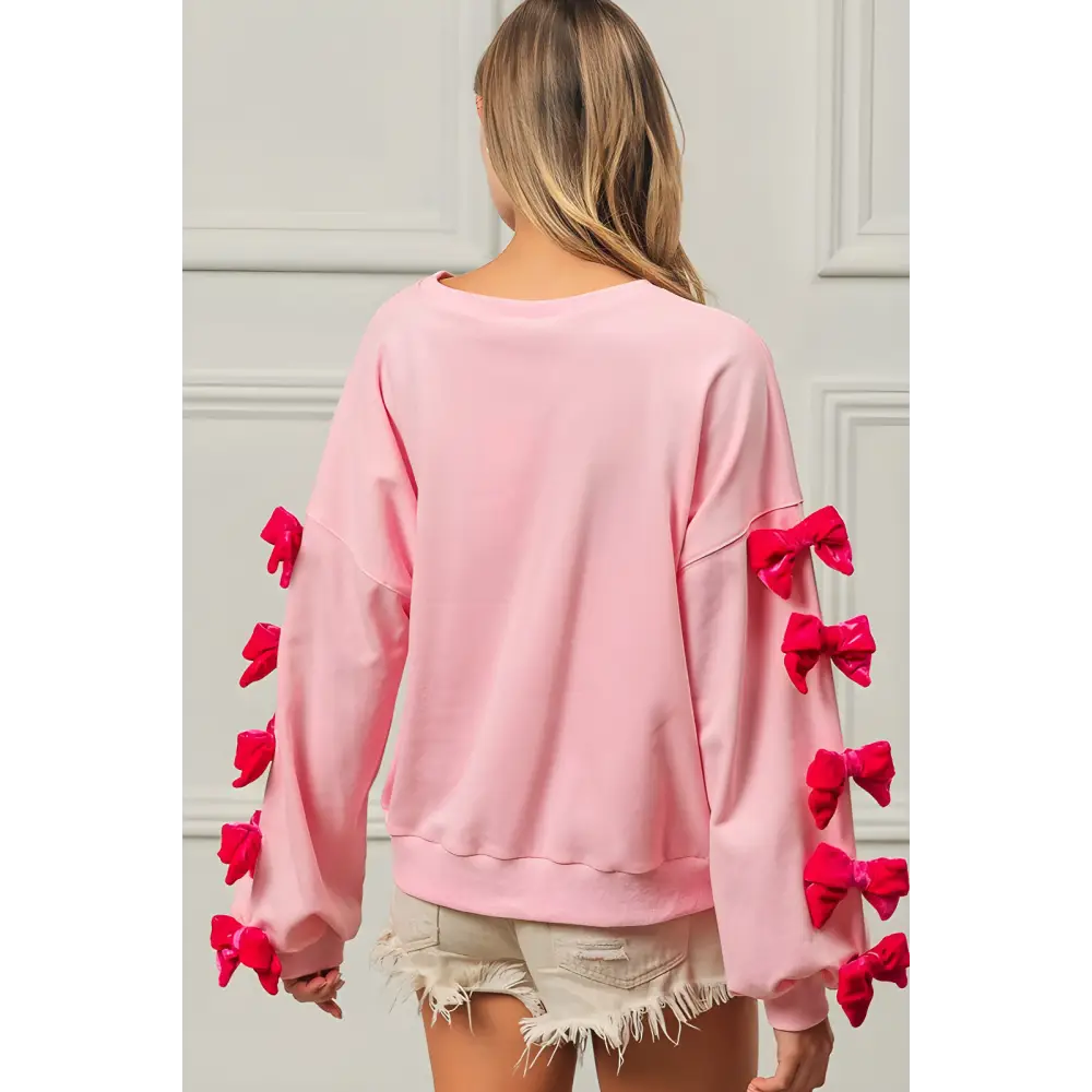 Bibi velvet ribbon bows sweatshirt elevates luxury fashion for women $54.99 the velvet ribbon bows long sleeve round