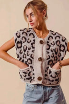Leopard print knitted sweater vest with big metal button front and two front pockets in beige and brown tones