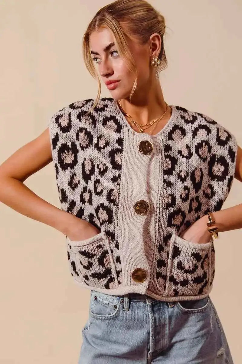 Leopard print knitted sweater vest with big metal button front and two front pockets in beige and brown tones