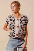 Leopard print sleeveless sweater vest with soft knit fabric and Big Metal Button front, featuring patch pockets and rolled edges