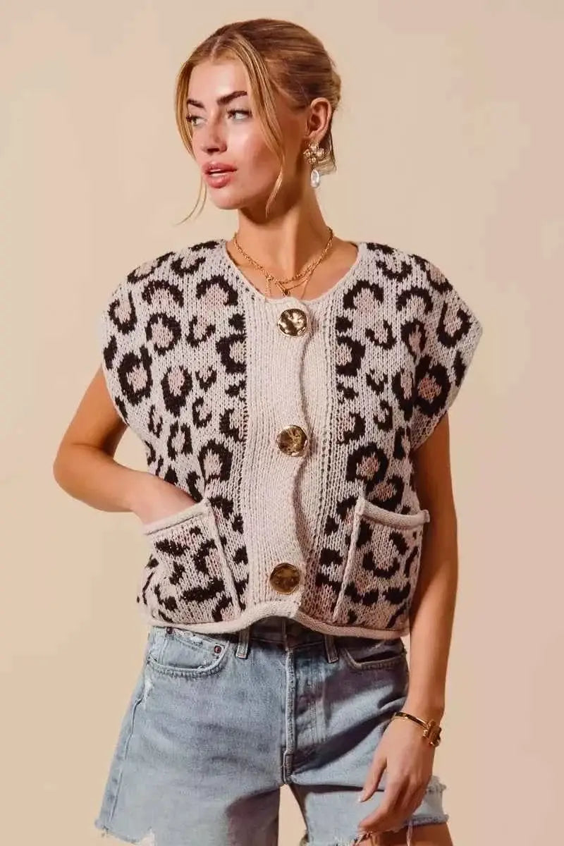 Leopard print sleeveless sweater vest with soft knit fabric and Big Metal Button front, featuring patch pockets and rolled edges