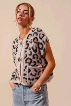 Leopard print knitted sweater vest with Big Metal Button front closure and front pockets in beige and dark brown tones
