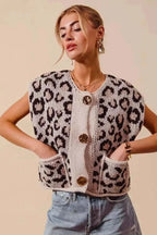 Big Metal Button leopard print sweater vest in beige and black knit with oversized metal buttons and front pockets worn by model