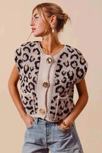 Leopard print sweater vest top with beige knit contrasting panel and three big metal button closures, worn with casual jeans