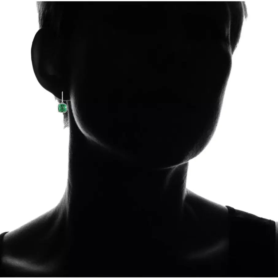 Blue Sapphire & Emerald drop earrings featuring 8mm cushion cut green emerald stones set in silver fish hook backings worn on ear