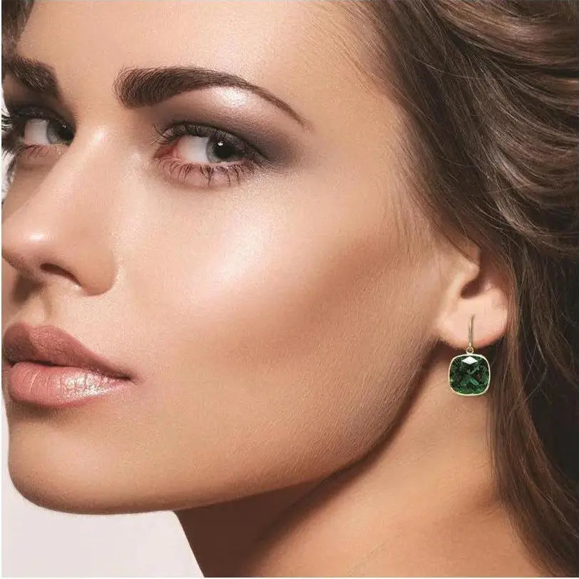 Drop earring featuring a cushion cut created emerald with 8mm square green gemstone in 14kt yellow gold over sterling silver, showcasing Blue Sapphire & Emerald elegance