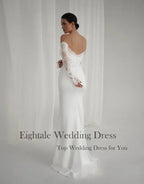 Bohemian Mermaid Wedding Dress in white featuring off-shoulder lace sleeves and a fitted mermaid silhouette with sweep train