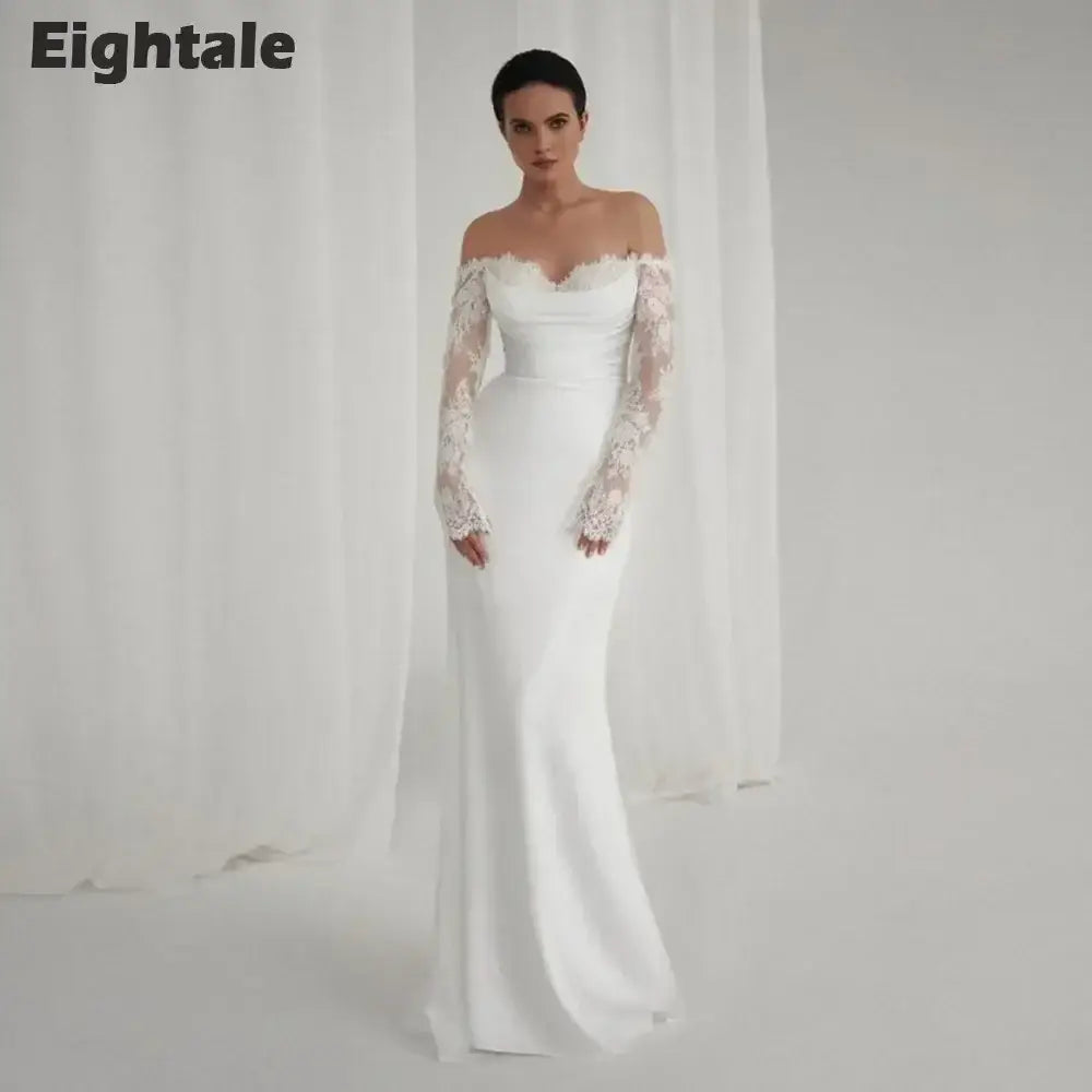 Bohemian Mermaid Wedding Dress in white lace featuring off-shoulder sweetheart neckline and long lace sleeves