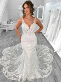 Boho Mermaid Wedding dress in white lace with open back, V-neck, spaghetti straps, and a sheer detailed train