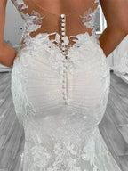 Boho Mermaid Wedding dress in white polyester tulle with lace appliques and button back closure on fitted silhouette