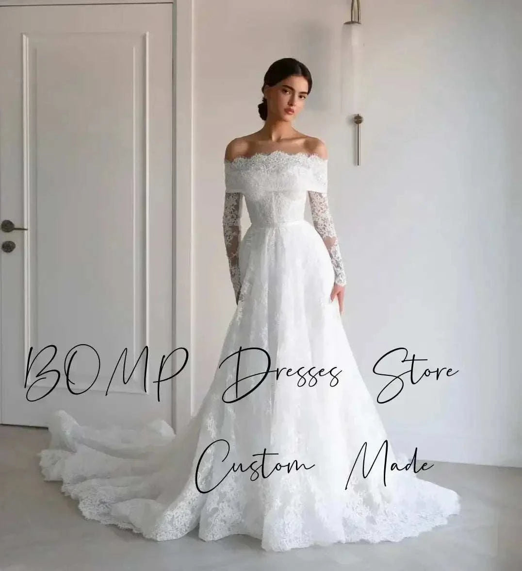 Elegant Lace Wedding Dress in ivory featuring off shoulder sweetheart neckline, full lace sleeves, and sweep train design