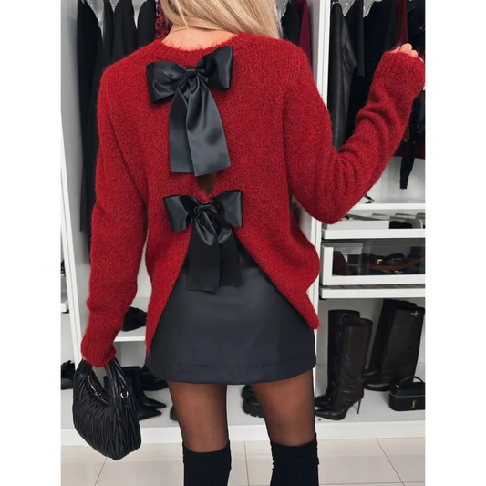 Elevate your wardrobe with the bow slit back round neck sweater $32.99 exquisite bow design delightfully slightly