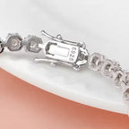 Brilliant Flower Created Moissanite Tennis Bracelet in 925 sterling silver with 14K white gold overlay and flower-shaped settings