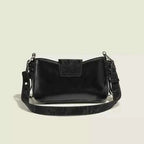 Small black PU leather crossbody bag with a flap closure featuring Butterfly Decor Flap design and adjustable strap