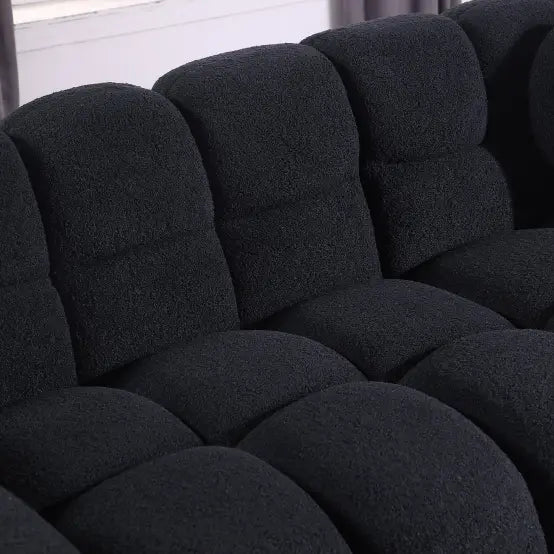 Elegant black boucle sofa for timeless designer living spaces