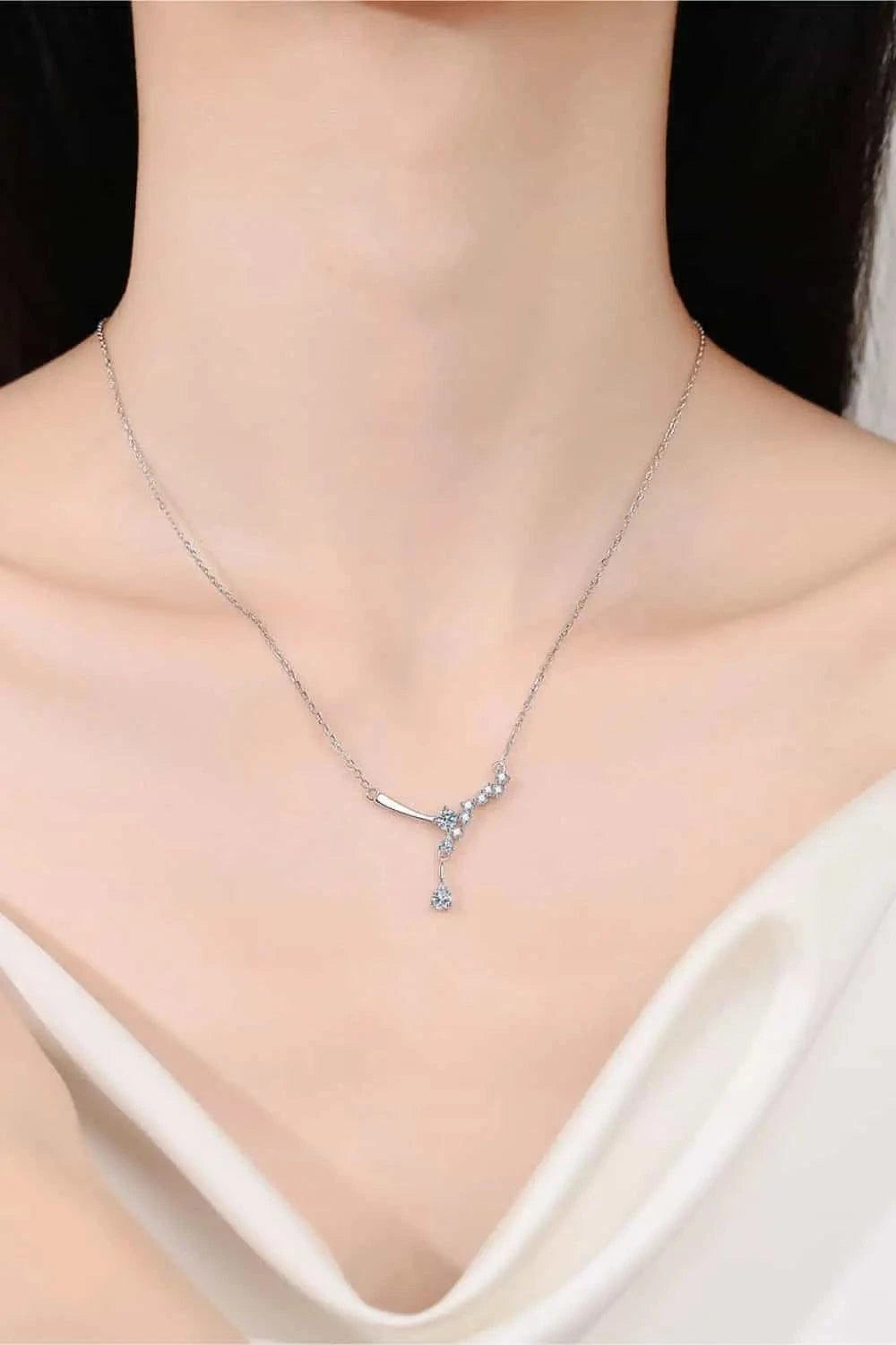 925 sterling silver necklace with delicate Carat Moissanite stones in a Y-shaped design on a fine chain